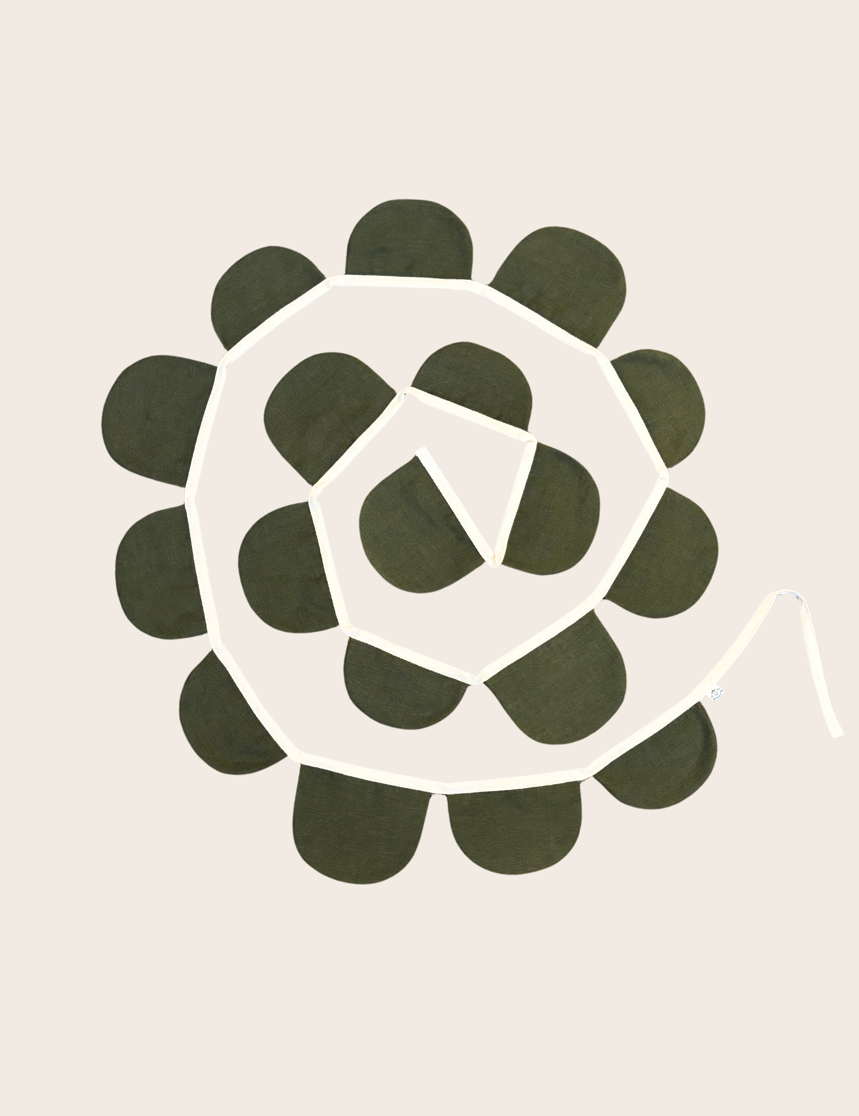 A Scallop garland, with 18 flags of varying half circle shapes on a beige ribbon. Displayed on a beige background.